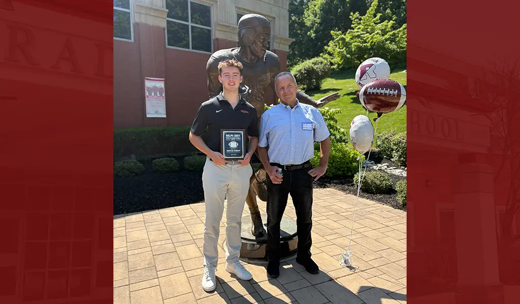 Bryce Furey holding the 2026 Ralph Gray Award